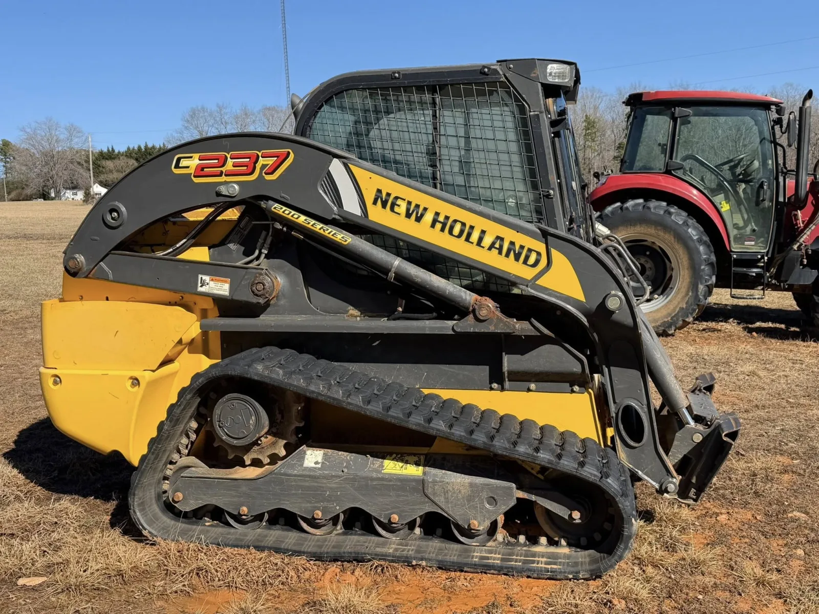 Second view of the cleaned skid steer loader after equipment detailing by Romeo's Detailing